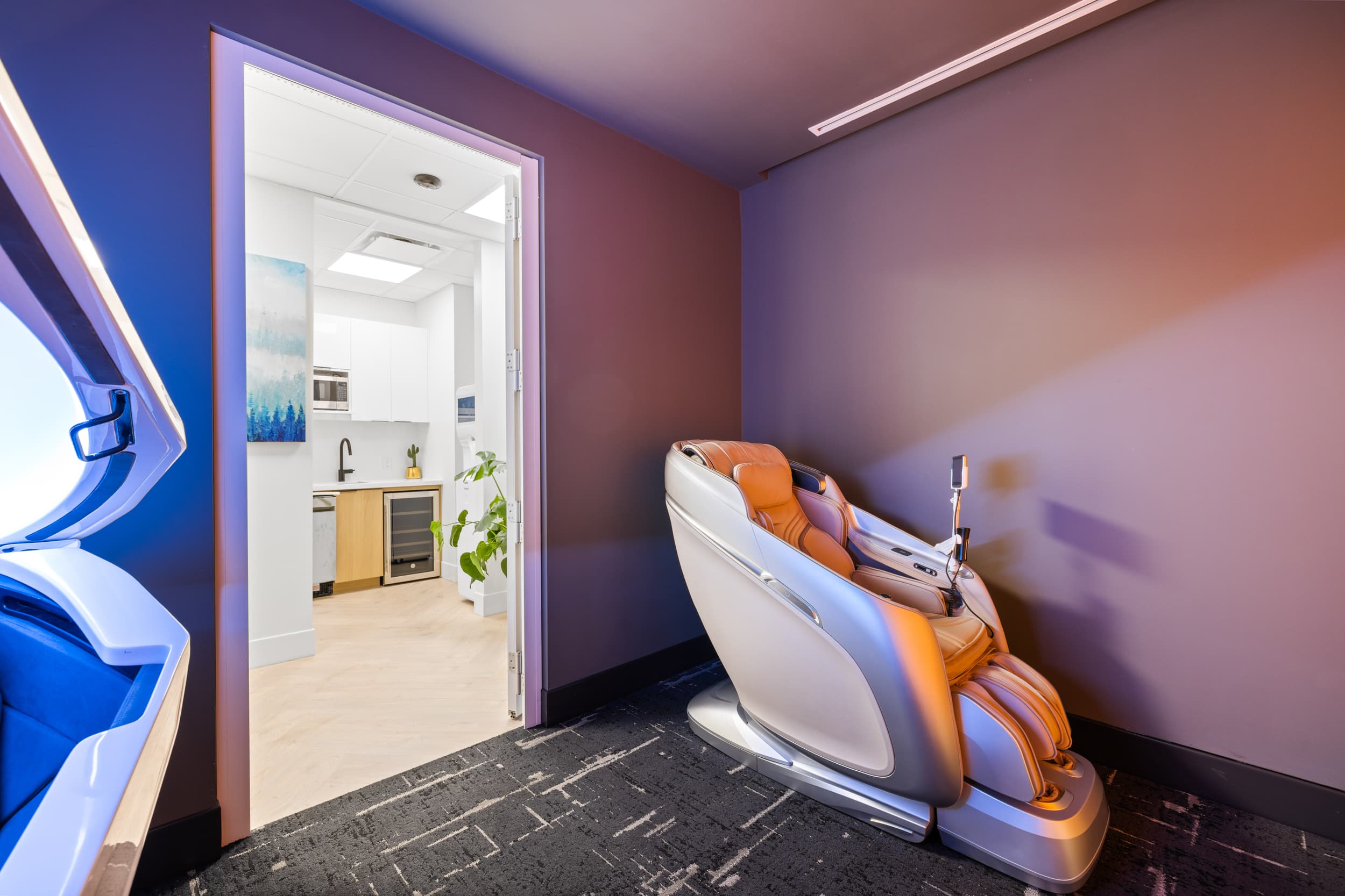 Massage chair wellness area at Jilani Place